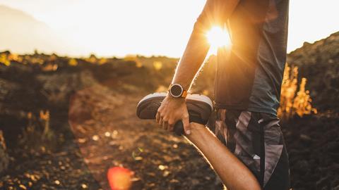 male-runner-stretching-leg-and-feet-and-preparing-2024-09-23-01-23-44-utc-envato